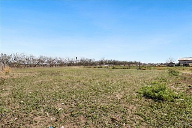 view of yard with a rural view