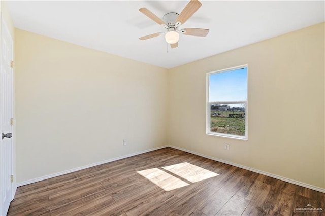 unfurnished room featuring ceiling fan and hardwood / wood-style floors