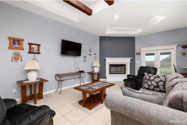 living room with light tile patterned flooring, a raised ceiling, and french doors