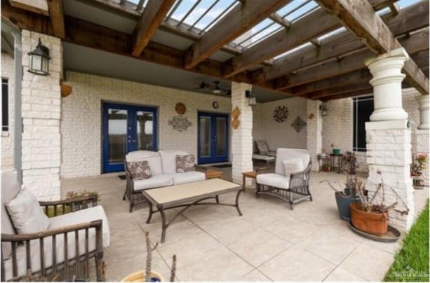 view of patio with a pergola, french doors, and an outdoor hangout area