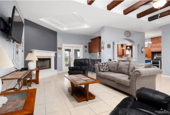 living room featuring french doors, ceiling fan, and light tile patterned flooring