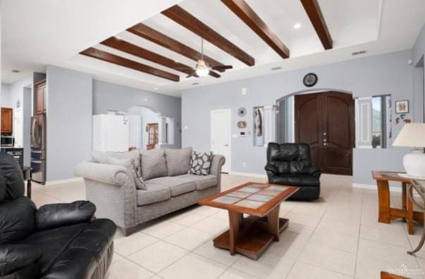 living room with ceiling fan, beam ceiling, and light tile patterned flooring