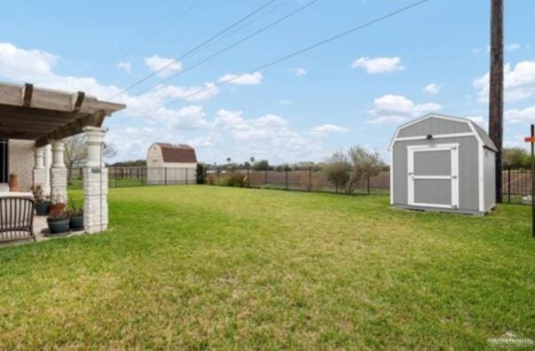 view of yard featuring a pergola and a storage unit