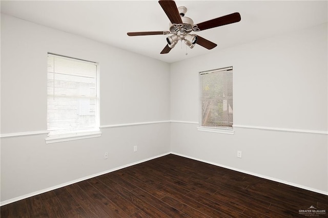 spare room featuring ceiling fan, baseboards, and wood finished floors