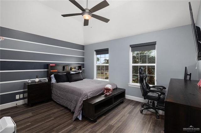 bedroom with dark wood-type flooring, vaulted ceiling, baseboards, and a ceiling fan