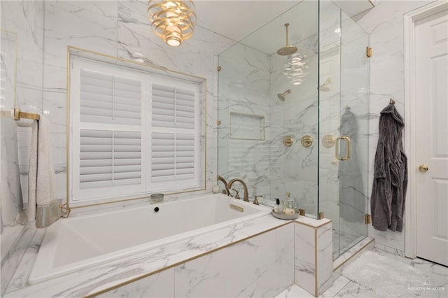 bathroom with a garden tub, a marble finish shower, and marble finish floor