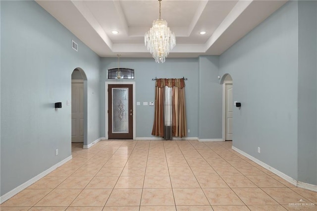 3417 N Pablo St N, Edinburg, TX 78541 - tiled foyer entrance with a raised ceiling, arched walkways, recessed lighting, and an inviting chandelier