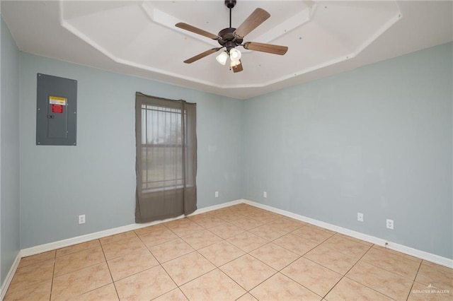 3417 N Pablo St N, Edinburg, TX 78541 - tiled empty room featuring electric panel, a ceiling fan, baseboards, and a raised ceiling