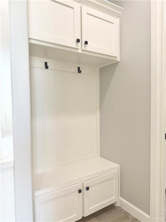 1203 Moses Dr, San Juan, TX 78589 - mudroom featuring baseboards
