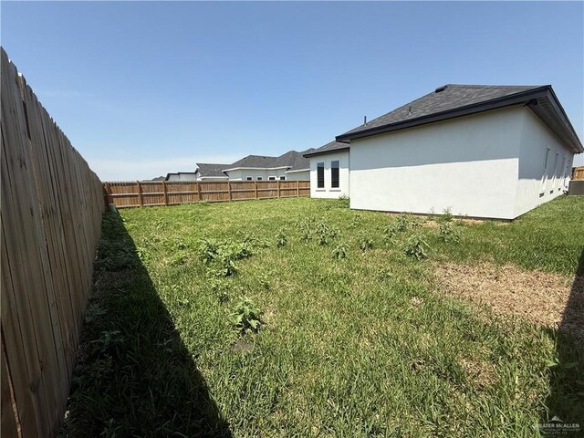 1203 Moses Dr, San Juan, TX 78589 - view of yard featuring a fenced backyard