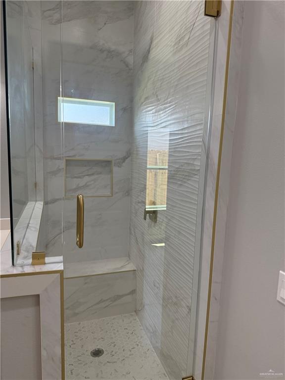 1203 Moses Dr, San Juan, TX 78589 - full bath featuring a marble finish shower
