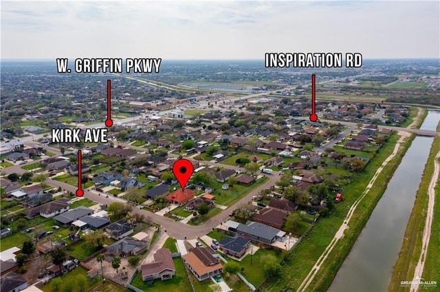 bird's eye view with a water view and a residential view