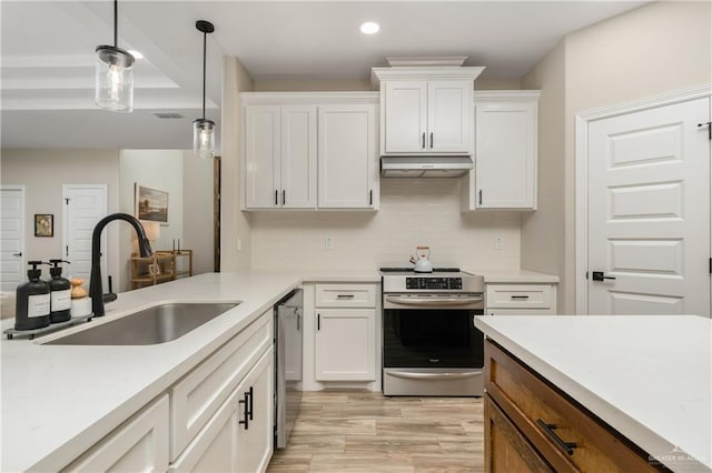 kitchen with sink, white cabinetry, stainless steel appliances, and hanging light fixtures