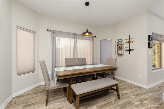 dining space with light wood-type flooring