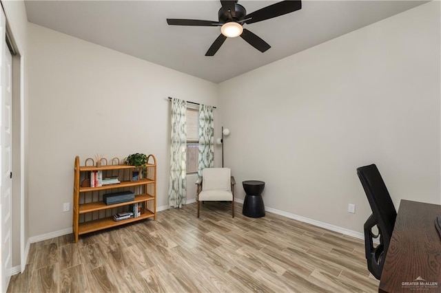 home office featuring ceiling fan and light hardwood / wood-style floors