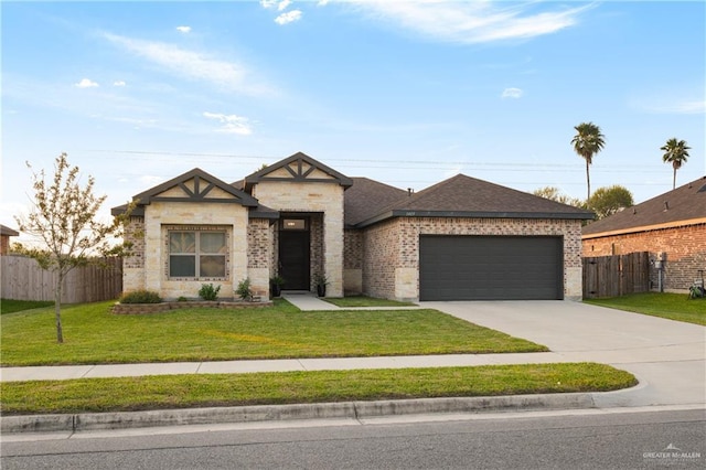 view of front of house featuring a front yard and a garage