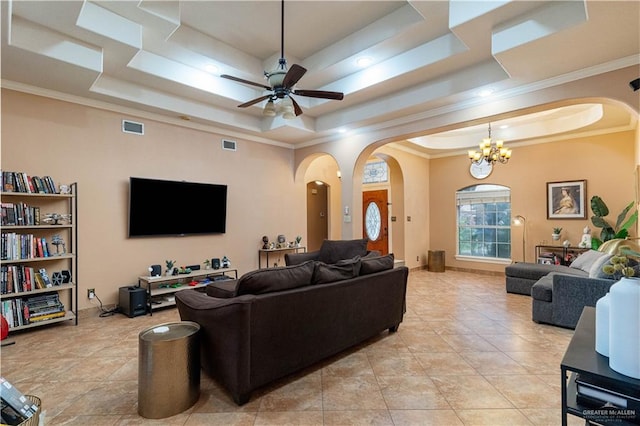 513 E Shasta Ave, Mcallen, TX 78504 - living area featuring arched walkways, a tray ceiling, a chandelier, ceiling fan, and crown molding