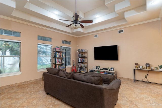 513 E Shasta Ave, Mcallen, TX 78504 - living room featuring a tray ceiling, a ceiling fan, light tile patterned flooring, and crown molding