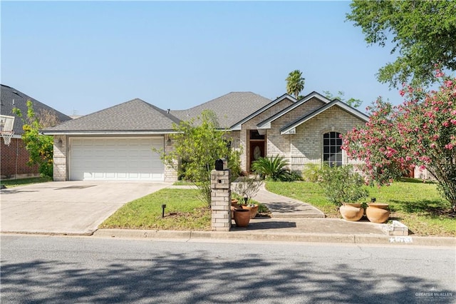 513 E Shasta Ave, Mcallen, TX 78504 - view of front of property with a garage, concrete driveway, and brick siding