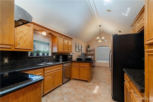 513 E Shasta Ave, Mcallen, TX 78504 - kitchen featuring stainless steel appliances, a peninsula, brown cabinetry, vaulted ceiling, and tasteful backsplash