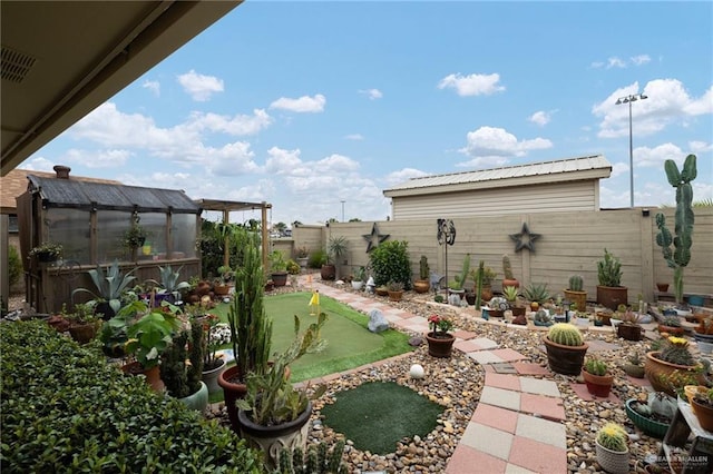 1813 Tyler St, Mission, TX 78572 - fenced backyard with an exterior structure, an area to practice putting, and an outbuilding