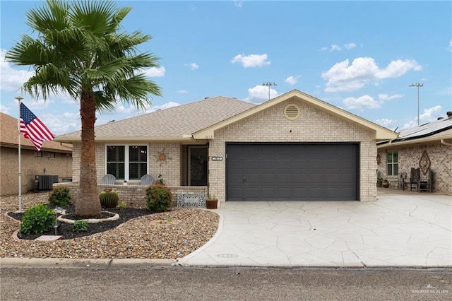 1813 Tyler St, Mission, TX 78572 - single story home with a garage, concrete driveway, brick siding, and roof with shingles