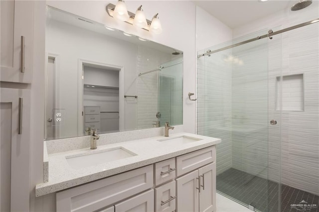 bathroom featuring vanity and walk in shower