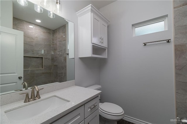 406 Hope Dr, La Feria, TX 78559 - full bath featuring tiled shower, vanity, and toilet