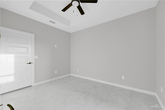 bathroom with a tile shower, vanity, and toilet