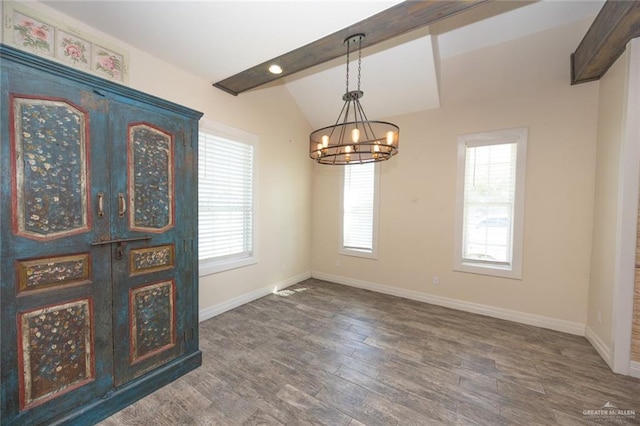 interior space with vaulted ceiling with beams, dark hardwood / wood-style flooring, and a chandelier