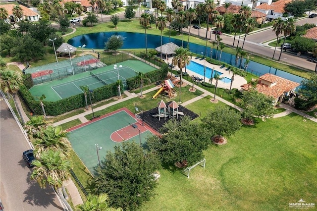 birds eye view of property with a water view