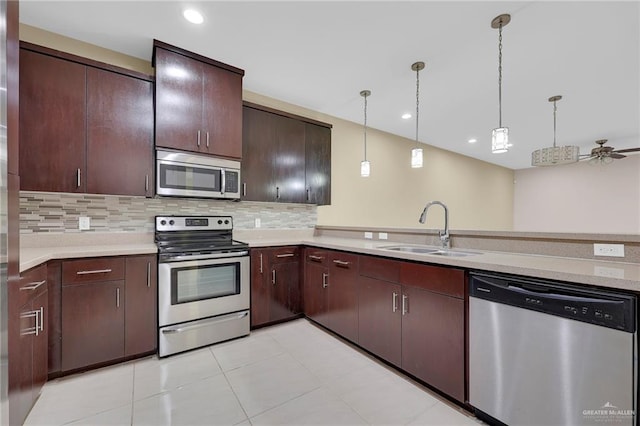 1425 Ozark Ave, Mcallen, TX 78504 - kitchen with appliances with stainless steel finishes, a sink, light countertops, backsplash, and recessed lighting
