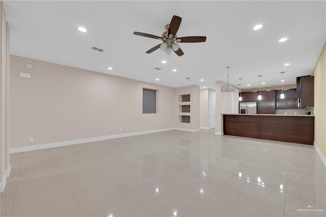 1425 Ozark Ave, Mcallen, TX 78504 - unfurnished living room featuring a ceiling fan, baseboards, built in features, light tile patterned floors, and recessed lighting
