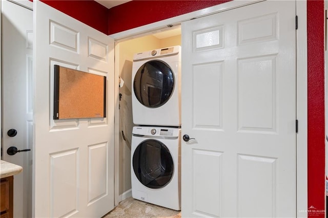 washroom with stacked washer and dryer