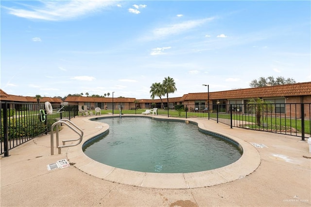 view of swimming pool featuring a patio area