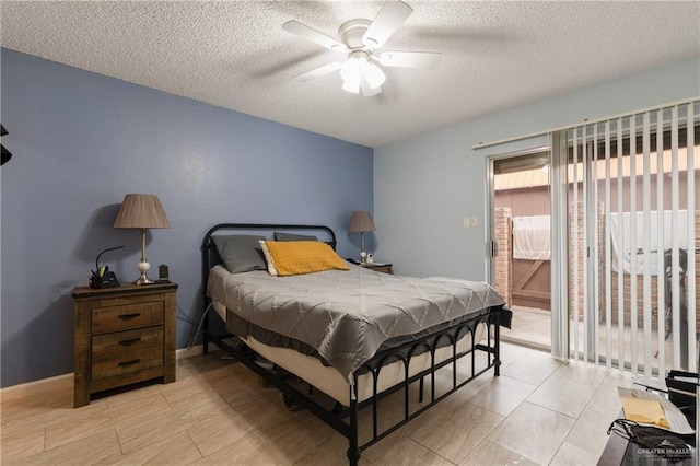 bedroom featuring ceiling fan and a textured ceiling