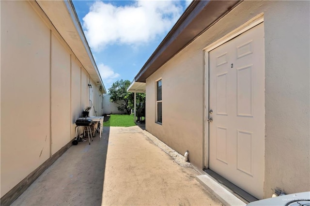 408 S 21st St, Mcallen, TX 78501 - property entrance with stucco siding and a patio area