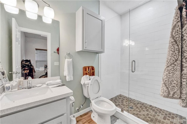 408 S 21st St, Mcallen, TX 78501 - bathroom featuring a stall shower, vanity, ensuite bath, and toilet
