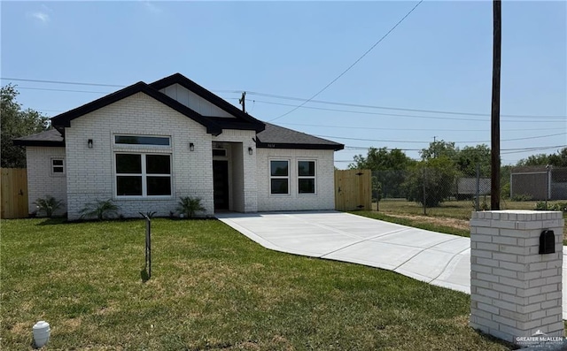 3614 Tecate St, Edinburg, TX 78542 - view of front facade with brick siding and concrete driveway