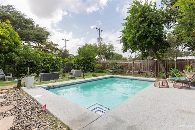 view of swimming pool featuring a patio area, a fenced backyard, and a fenced in pool