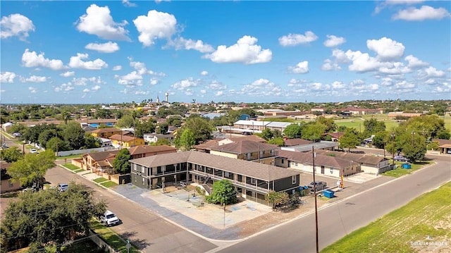 birds eye view of property with a residential view