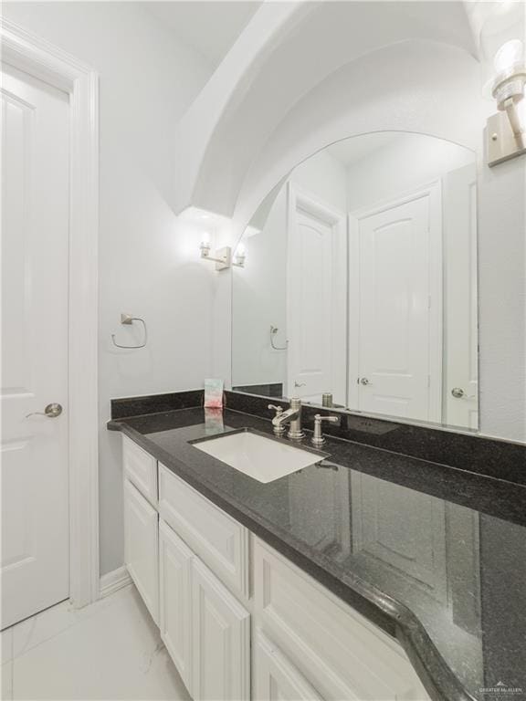 2511 Wisteria St, Rio Grande City, TX 78582 - bathroom with vanity and marble look tiles