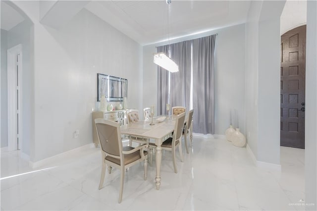 2511 Wisteria St, Rio Grande City, TX 78582 - dining space featuring arched walkways and light marble finish floors