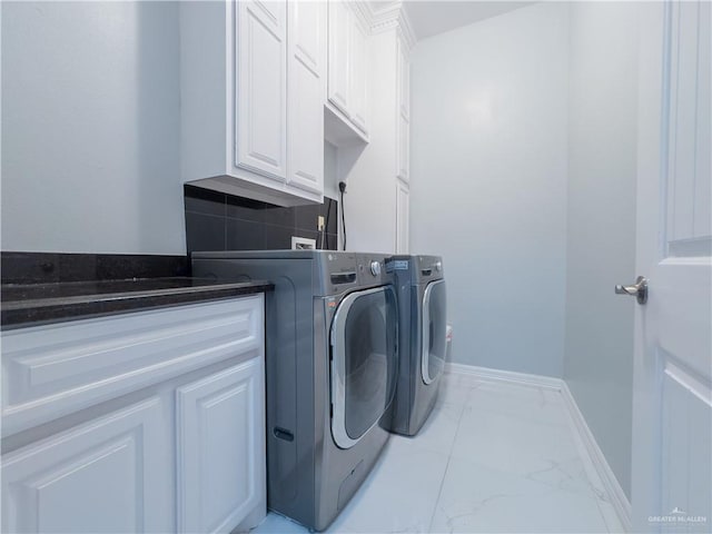 2511 Wisteria St, Rio Grande City, TX 78582 - washroom featuring cabinet space, marble look tiles, and independent washer and dryer