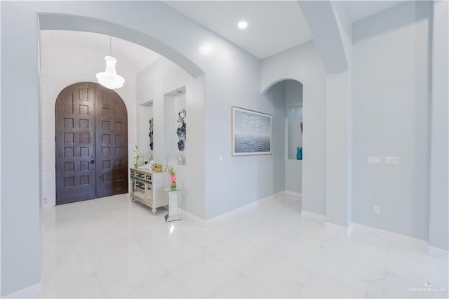 2511 Wisteria St, Rio Grande City, TX 78582 - entrance foyer featuring marble finish floors and arched walkways