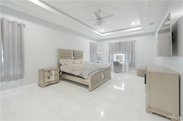 2511 Wisteria St, Rio Grande City, TX 78582 - bedroom featuring light marble finish flooring, a tray ceiling, a ceiling fan, and recessed lighting