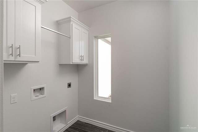 clothes washing area with dark wood-style floors, hookup for a washing machine, cabinet space, and electric dryer hookup