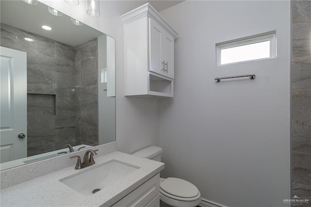 bathroom featuring vanity and toilet