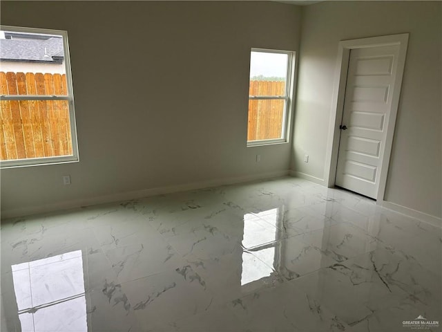 1506 Las Palmas Ave, Hidalgo, TX 78557 - spare room with marble look tile flooring and baseboards