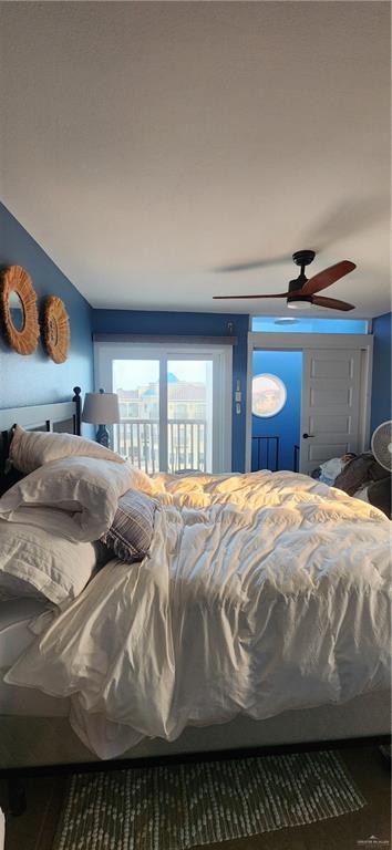6201 Padre Blvd Unit 308, South Padre Island, TX 78597 - bedroom with ceiling fan